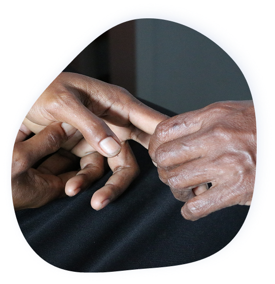 Image of a person's hand measuring pulse of another person's hand